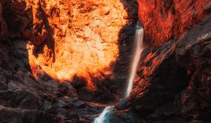 Preview wallpaper waterfall, rocks, stones, stream, light