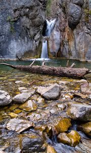 Preview wallpaper waterfall, rocks, stones, log, water