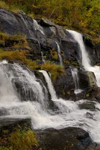 Preview wallpaper waterfall, rocks, stones, stream, grass