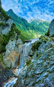 Preview wallpaper waterfall, rocks, water, relief, trees, mountains