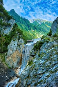 Preview wallpaper waterfall, rocks, water, relief, trees, mountains