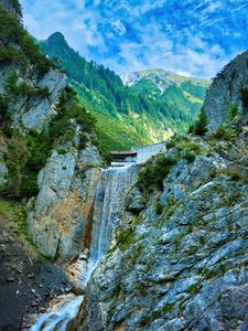 Preview wallpaper waterfall, rocks, water, relief, trees, mountains