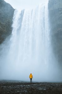 Preview wallpaper waterfall, silhouette, man, water, clif