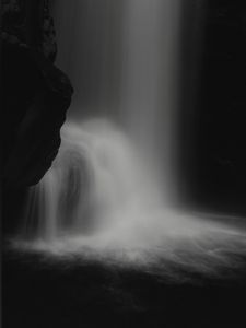 Preview wallpaper waterfall, stone, water, black and white, dark