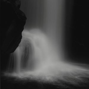 Preview wallpaper waterfall, stone, water, black and white, dark