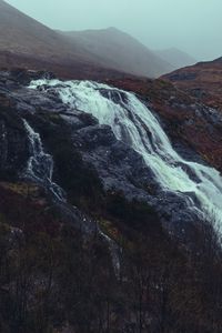 Preview wallpaper waterfall, stones, cliff, trees, autumn