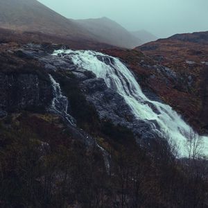 Preview wallpaper waterfall, stones, cliff, trees, autumn