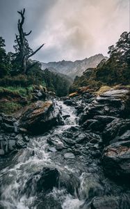 Preview wallpaper waterfall, stones, current, grass, mountains