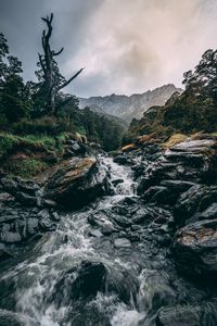 Preview wallpaper waterfall, stones, current, grass, mountains