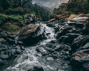 Preview wallpaper waterfall, stones, current, grass, mountains