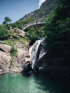 Preview wallpaper waterfall, stones, lake, glare, bridge