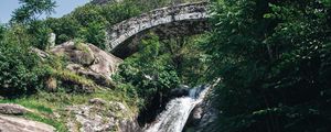 Preview wallpaper waterfall, stones, lake, glare, bridge