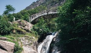 Preview wallpaper waterfall, stones, lake, glare, bridge