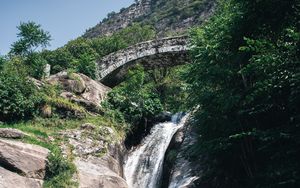 Preview wallpaper waterfall, stones, lake, glare, bridge
