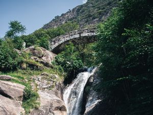 Preview wallpaper waterfall, stones, lake, glare, bridge
