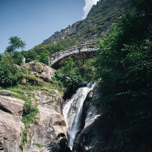 Preview wallpaper waterfall, stones, lake, glare, bridge