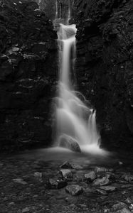 Preview wallpaper waterfall, stones, splashes, dark, black and white