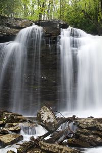 Preview wallpaper waterfall, stones, spray, logs, nature