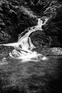 Preview wallpaper waterfall, stones, water, black and white, trees