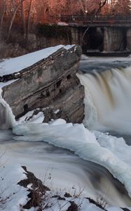Preview wallpaper waterfall, water, river, stones, snow, winter, nature