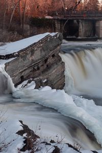Preview wallpaper waterfall, water, river, stones, snow, winter, nature