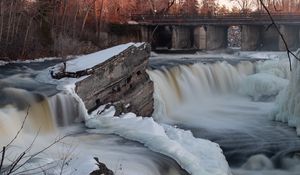 Preview wallpaper waterfall, water, river, stones, snow, winter, nature