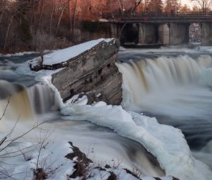 Preview wallpaper waterfall, water, river, stones, snow, winter, nature