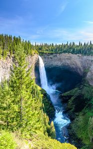 Preview wallpaper waterfall, water, rock, spruce, trees, sky