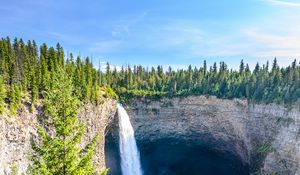 Preview wallpaper waterfall, water, rock, spruce, trees, sky