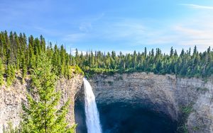 Preview wallpaper waterfall, water, rock, spruce, trees, sky