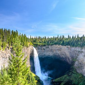 Preview wallpaper waterfall, water, rock, spruce, trees, sky