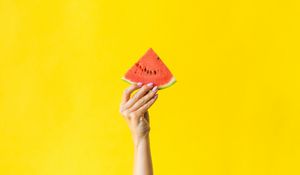 Preview wallpaper watermelon, hand, yellow, red, berry, fruit