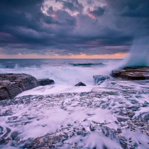 Preview wallpaper waves, coast, stone, storm, splashes, cloudy, splash, horizon, foam, clouds