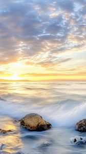 Preview wallpaper waves, sea, stones, shore, sky, clouds, sun, horizon