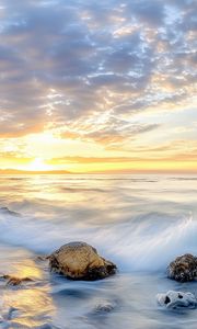 Preview wallpaper waves, sea, stones, shore, sky, clouds, sun, horizon
