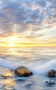 Preview wallpaper waves, sea, stones, shore, sky, clouds, sun, horizon