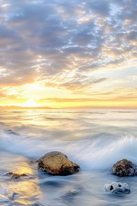 Preview wallpaper waves, sea, stones, shore, sky, clouds, sun, horizon