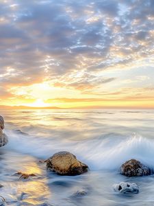 Preview wallpaper waves, sea, stones, shore, sky, clouds, sun, horizon