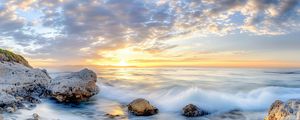 Preview wallpaper waves, sea, stones, shore, sky, clouds, sun, horizon