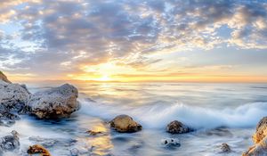 Preview wallpaper waves, sea, stones, shore, sky, clouds, sun, horizon