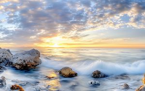 Preview wallpaper waves, sea, stones, shore, sky, clouds, sun, horizon