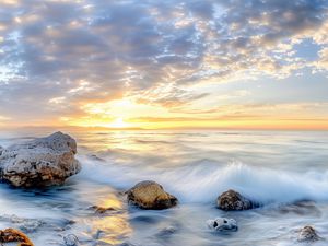 Preview wallpaper waves, sea, stones, shore, sky, clouds, sun, horizon