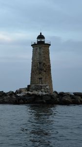 Preview wallpaper whaleback lighthouse, lighthouse, stones, sea, clouds, usa
