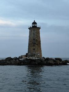 Preview wallpaper whaleback lighthouse, lighthouse, stones, sea, clouds, usa