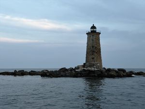 Preview wallpaper whaleback lighthouse, lighthouse, stones, sea, clouds, usa