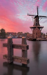 Preview wallpaper wind mill, buildings, river, sunset