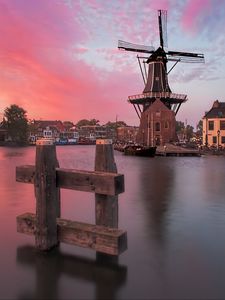 Preview wallpaper wind mill, buildings, river, sunset