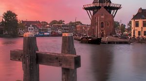 Preview wallpaper wind mill, buildings, river, sunset