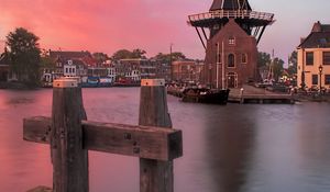 Preview wallpaper wind mill, buildings, river, sunset