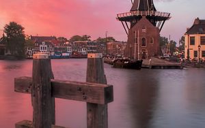 Preview wallpaper wind mill, buildings, river, sunset